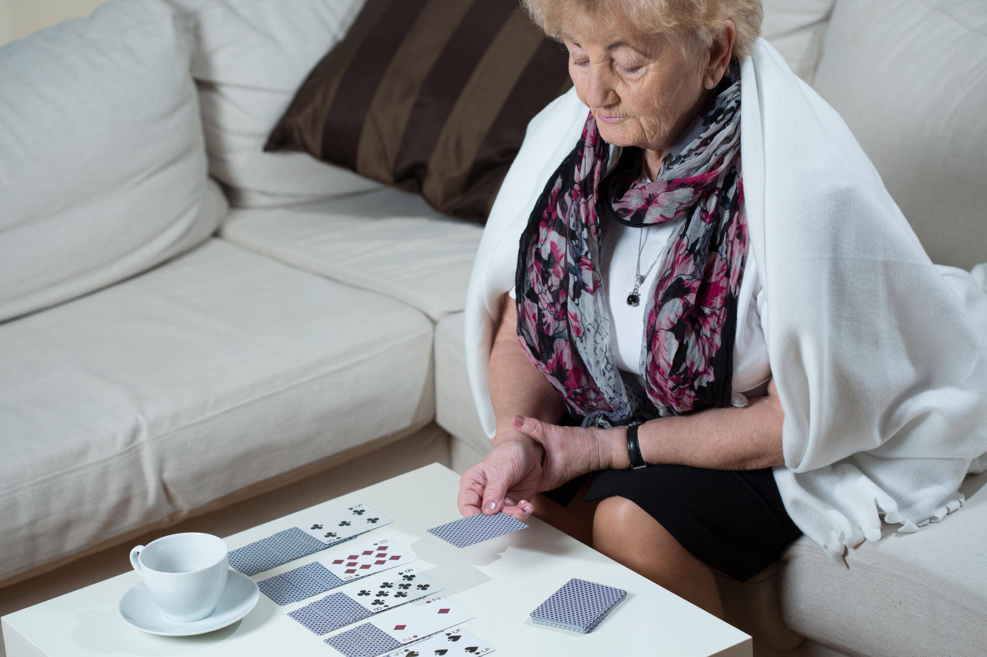 senior woman playing cards